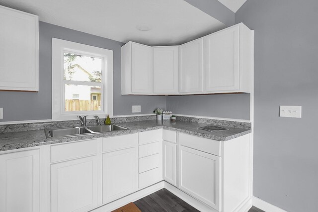 540 Park St, Marion, OH 43302 - kitchen featuring white cabinetry and dark wood-type flooring