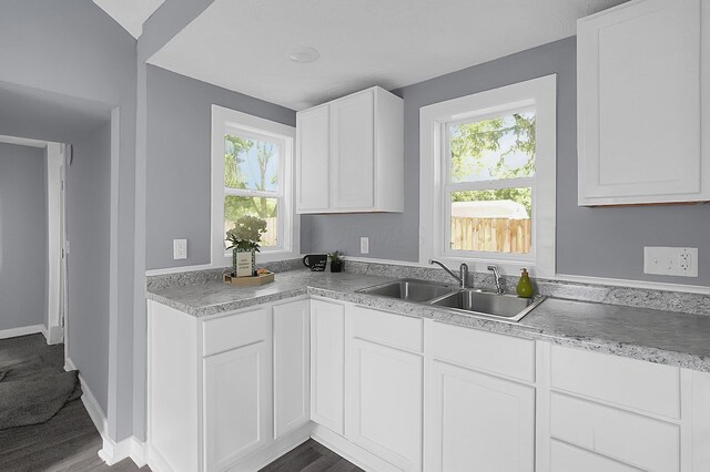 540 Park St, Marion, OH 43302 - kitchen featuring healthy amount of natural light, white cabinetry, light countertops, and dark wood finished floors