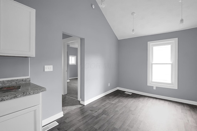 540 Park St, Marion, OH 43302 - unfurnished dining area featuring lofted ceiling and dark wood finished floors