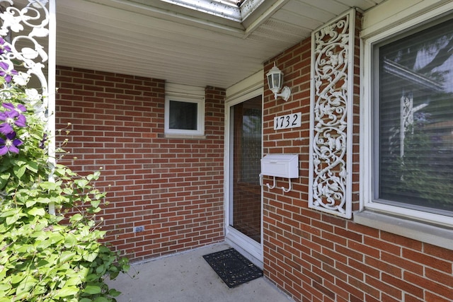1732 Lynnhurst Rd, Columbus, OH 43229 - view of exterior entry with a porch and brick siding