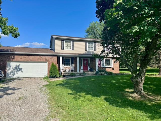 620 Rockmill Rd NW, Lancaster, OH 43130 - traditional home featuring covered porch, driveway, a front lawn, an attached garage, and brick siding