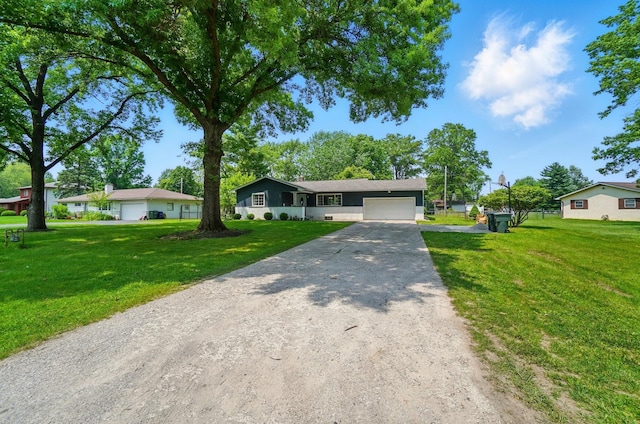 3722 Florian Dr, Columbus, OH 43219 - ranch-style home featuring a garage, a front lawn, and driveway