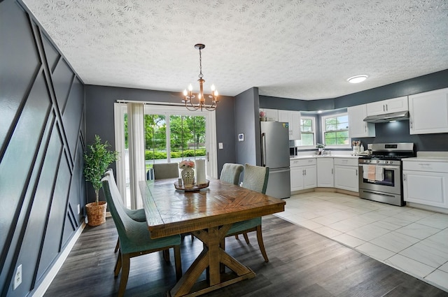 3722 Florian Dr, Columbus, OH 43219 - dining space featuring a chandelier and light wood-type flooring