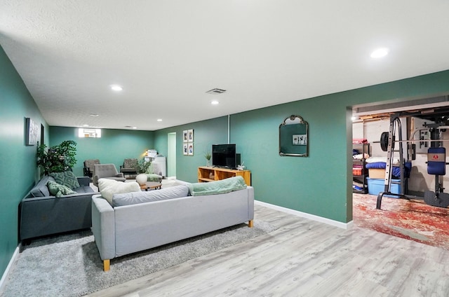 3722 Florian Dr, Columbus, OH 43219 - living area featuring wood finished floors and recessed lighting