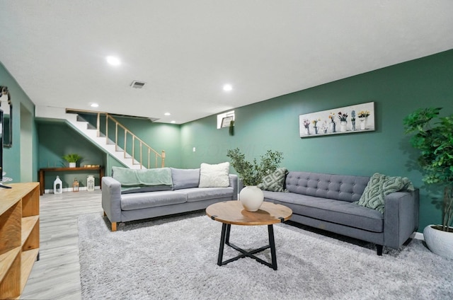 3722 Florian Dr, Columbus, OH 43219 - living room featuring stairs, wood finished floors, and recessed lighting