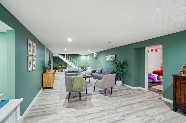 3722 Florian Dr, Columbus, OH 43219 - living room with stairs, light wood-type flooring, and recessed lighting