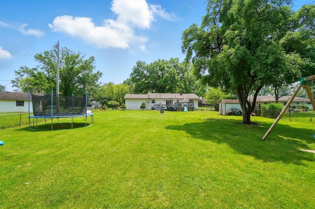 3722 Florian Dr, Columbus, OH 43219 - view of yard featuring a trampoline and a storage unit