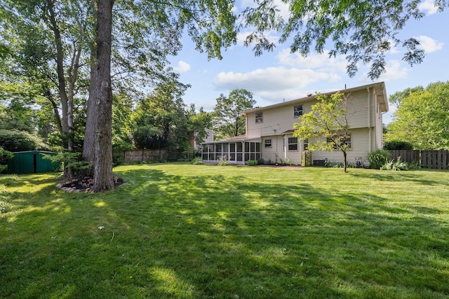 1295 Castleton Rd N, Columbus, OH 43220 - fenced backyard featuring a sunroom