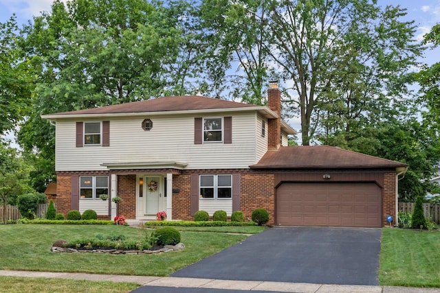 1295 Castleton Rd N, Columbus, OH 43220 - view of front facade featuring brick siding, a garage, and a chimney