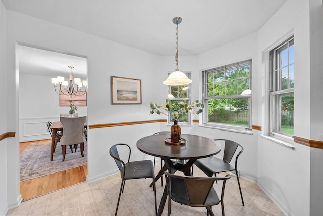 1295 Castleton Rd N, Columbus, OH 43220 - dining area featuring a chandelier and light wood finished floors