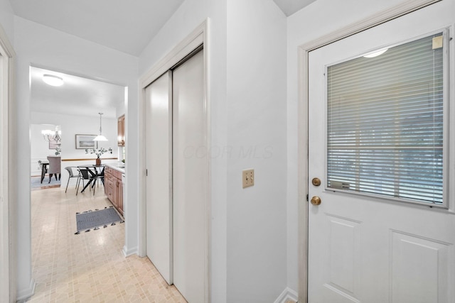 1295 Castleton Rd N, Columbus, OH 43220 - corridor with baseboards and a chandelier