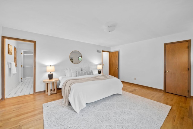 1295 Castleton Rd N, Columbus, OH 43220 - bedroom featuring light wood-style flooring and ensuite bath