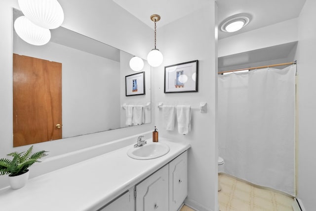 1295 Castleton Rd N, Columbus, OH 43220 - full bathroom with baseboard heating, vanity, tile patterned floors, and curtained shower