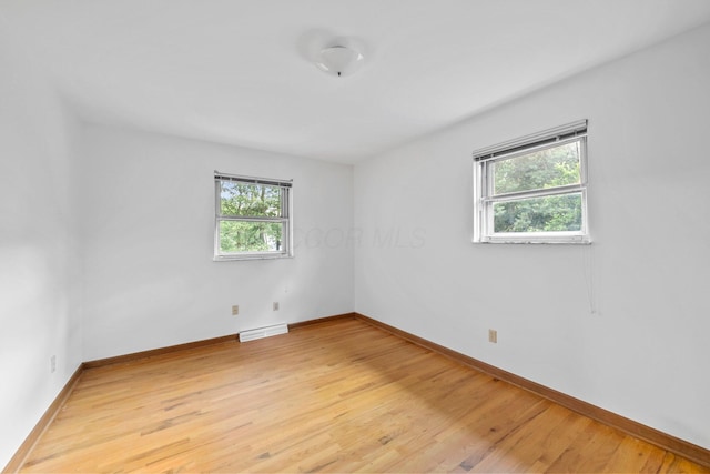 1295 Castleton Rd N, Columbus, OH 43220 - unfurnished room featuring healthy amount of natural light and light wood-style flooring