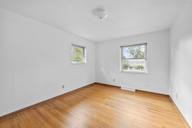 1295 Castleton Rd N, Columbus, OH 43220 - empty room featuring light wood finished floors and baseboards