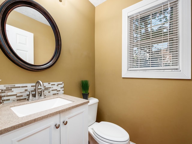 304 Cottage Grove Cir, Pataskala, OH 43062 - half bathroom with vanity and tasteful backsplash