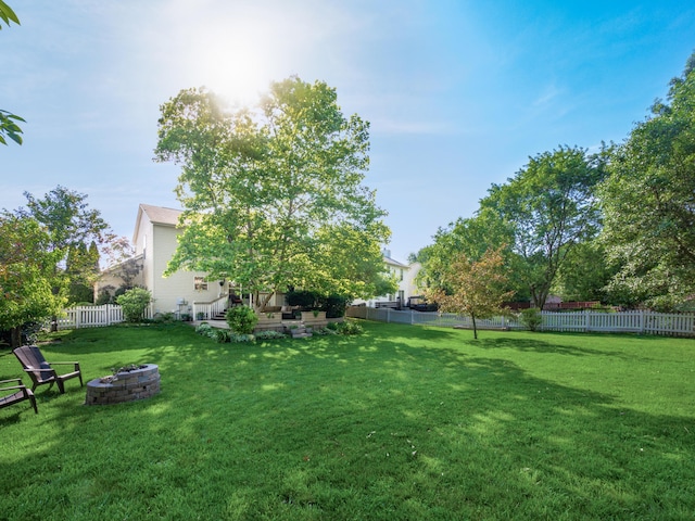 304 Cottage Grove Cir, Pataskala, OH 43062 - fenced yard with an outdoor fire pit