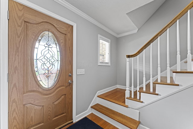 1292 Churchbell Way, Columbus, OH 43235 - foyer entrance featuring stairway, plenty of natural light, crown molding, and wood finished floors