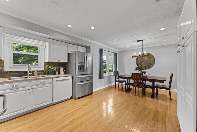 1292 Churchbell Way, Columbus, OH 43235 - kitchen with stainless steel refrigerator with ice dispenser, white dishwasher, light wood-style flooring, white cabinets, and backsplash