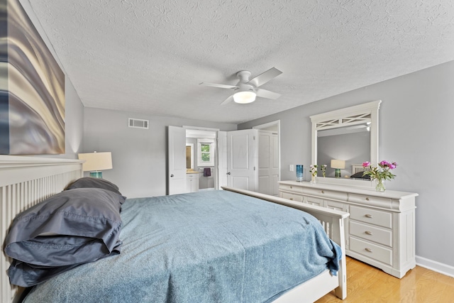 1292 Churchbell Way, Columbus, OH 43235 - bedroom with light wood-type flooring, ceiling fan, and a textured ceiling