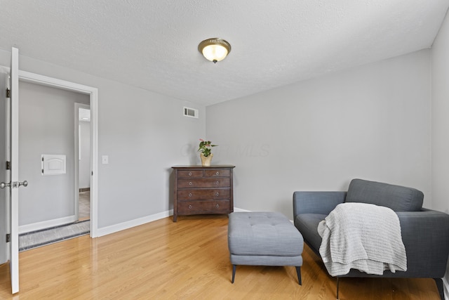 1292 Churchbell Way, Columbus, OH 43235 - sitting room with light wood-type flooring and a textured ceiling