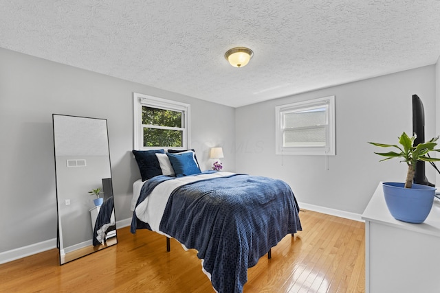 1292 Churchbell Way, Columbus, OH 43235 - bedroom with light wood-style flooring and a textured ceiling