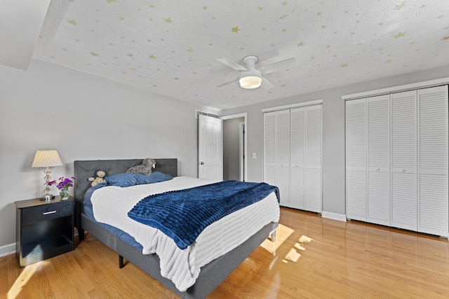 1292 Churchbell Way, Columbus, OH 43235 - bedroom with wood finished floors, two closets, and a ceiling fan