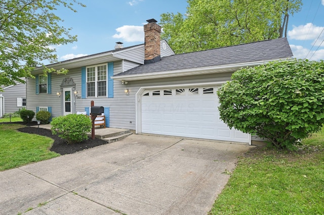 1853 Shasta Dr, Lancaster, OH 43130 - raised ranch with a chimney, driveway, an attached garage, roof with shingles, and a front lawn