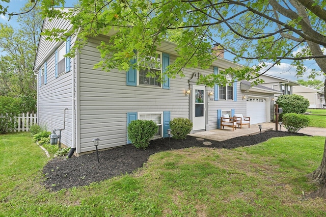 1853 Shasta Dr, Lancaster, OH 43130 - rear view of house with an attached garage, a yard, and a chimney