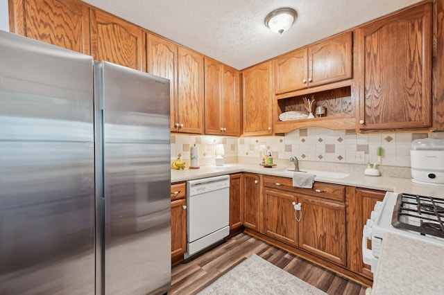 1853 Shasta Dr, Lancaster, OH 43130 - kitchen with white appliances, dark wood-type flooring, light countertops, a textured ceiling, and decorative backsplash