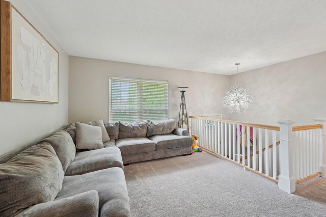 1853 Shasta Dr, Lancaster, OH 43130 - carpeted living room with a chandelier