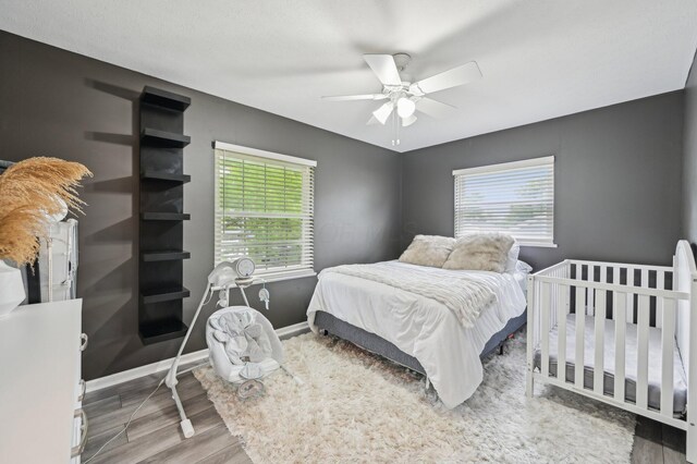 1853 Shasta Dr, Lancaster, OH 43130 - bedroom with wood finished floors, multiple windows, and a ceiling fan