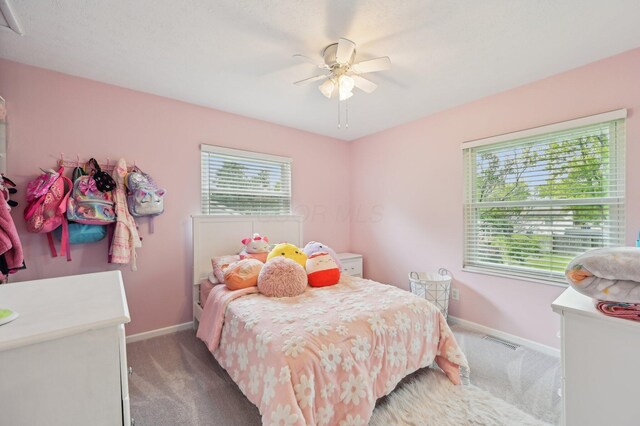 1853 Shasta Dr, Lancaster, OH 43130 - carpeted bedroom featuring multiple windows and ceiling fan