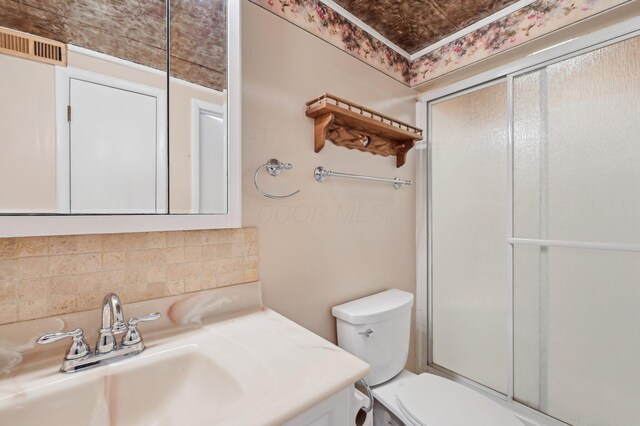 1853 Shasta Dr, Lancaster, OH 43130 - bathroom with tasteful backsplash, vanity, and an enclosed shower