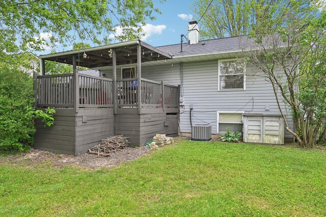 1853 Shasta Dr, Lancaster, OH 43130 - rear view of house featuring a yard, a chimney, a deck, and a shingled roof