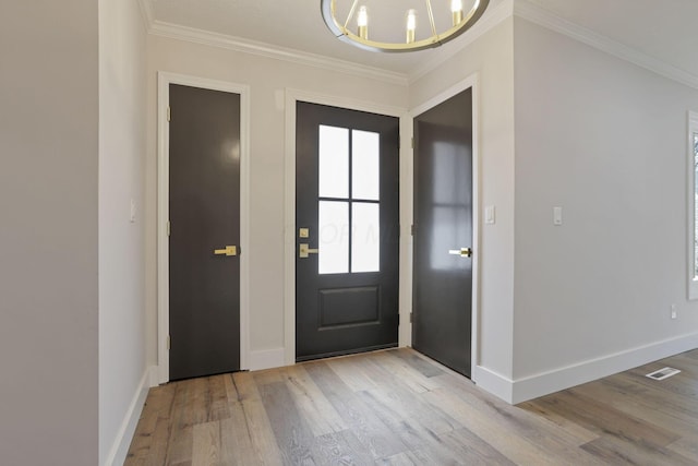 5200 Colt Ct, Westerville, OH 43081 - entrance foyer with wood finished floors, ornamental molding, and a chandelier