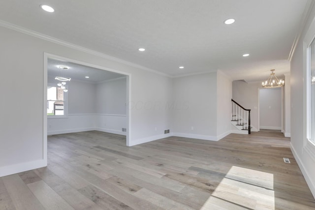 5200 Colt Ct, Westerville, OH 43081 - spare room with a chandelier, recessed lighting, crown molding, stairs, and light wood-style floors