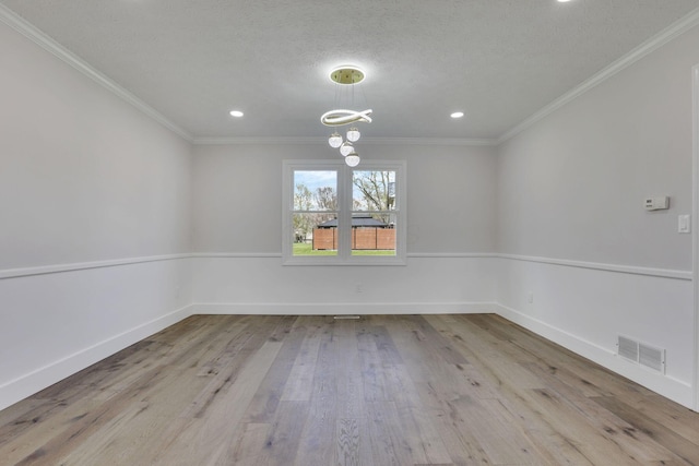 5200 Colt Ct, Westerville, OH 43081 - unfurnished room with wood finished floors, a chandelier, ornamental molding, recessed lighting, and a textured ceiling