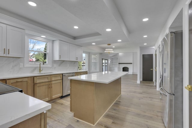 5200 Colt Ct, Westerville, OH 43081 - kitchen with stainless steel appliances, healthy amount of natural light, backsplash, a kitchen island, and recessed lighting