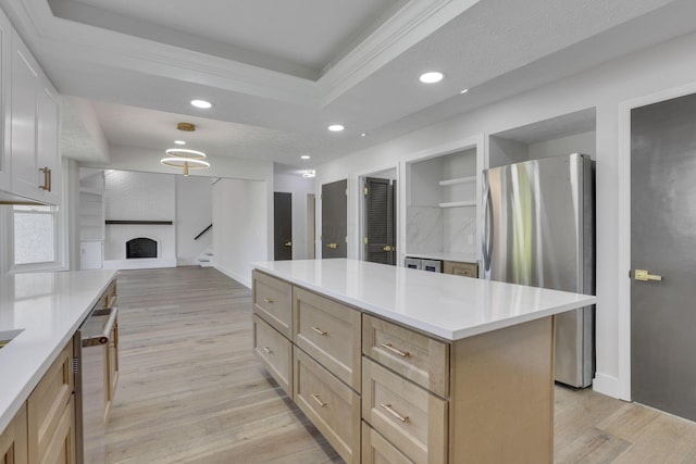 5200 Colt Ct, Westerville, OH 43081 - kitchen featuring freestanding refrigerator, light wood finished floors, a raised ceiling, open floor plan, and recessed lighting