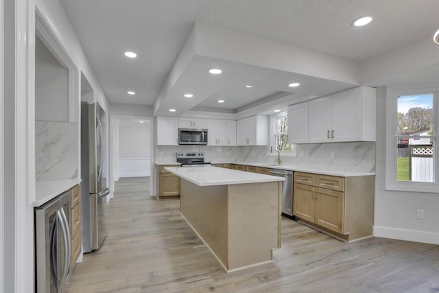 5200 Colt Ct, Westerville, OH 43081 - kitchen with stainless steel appliances, decorative backsplash, light wood-type flooring, light countertops, and recessed lighting