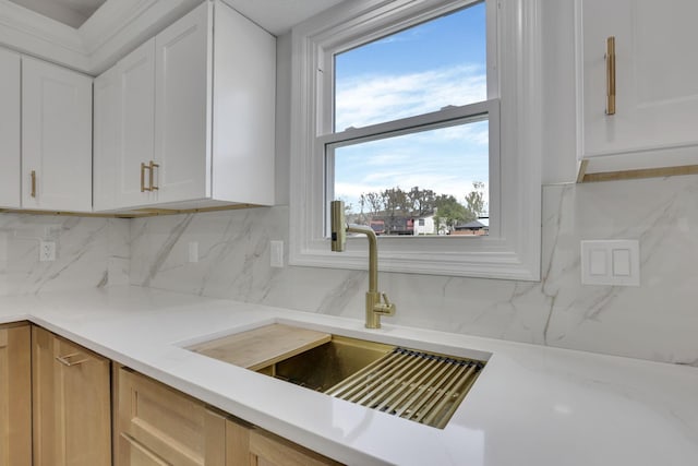 5200 Colt Ct, Westerville, OH 43081 - kitchen with white cabinetry, tasteful backsplash, and light stone countertops
