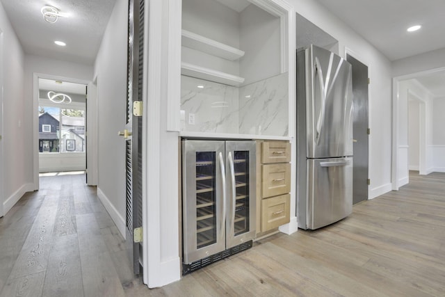5200 Colt Ct, Westerville, OH 43081 - bar with freestanding refrigerator, wine cooler, light wood finished floors, and recessed lighting