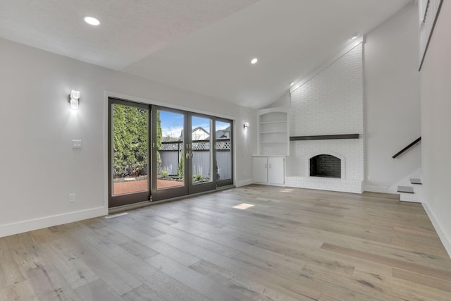 5200 Colt Ct, Westerville, OH 43081 - unfurnished living room featuring vaulted ceiling, built in features, stairway, recessed lighting, and light wood-style flooring