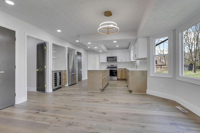 5200 Colt Ct, Westerville, OH 43081 - kitchen with stainless steel appliances, beverage cooler, a center island, a textured ceiling, and open shelves