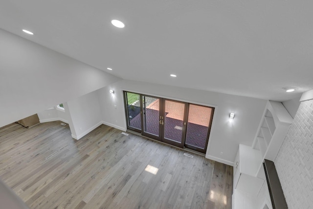 5200 Colt Ct, Westerville, OH 43081 - unfurnished living room with wood finished floors, recessed lighting, and lofted ceiling