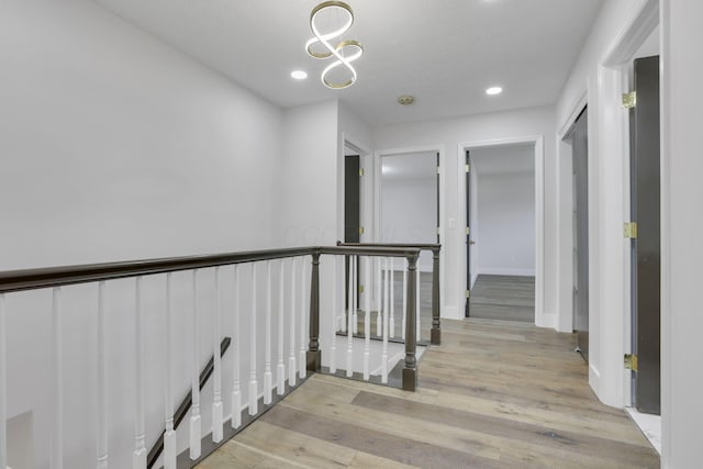 5200 Colt Ct, Westerville, OH 43081 - corridor featuring an upstairs landing, wood finished floors, recessed lighting, and a chandelier