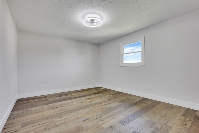 5200 Colt Ct, Westerville, OH 43081 - unfurnished room with wood finished floors and a textured ceiling