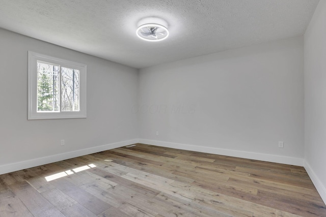 5200 Colt Ct, Westerville, OH 43081 - spare room with hardwood / wood-style flooring and a textured ceiling