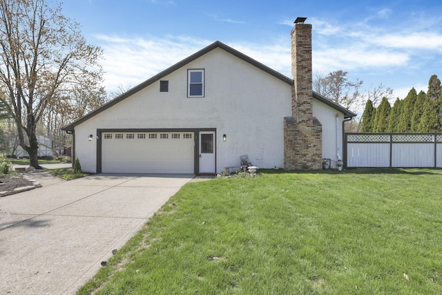 5200 Colt Ct, Westerville, OH 43081 - view of property exterior featuring stucco siding, a chimney, a garage, and concrete driveway